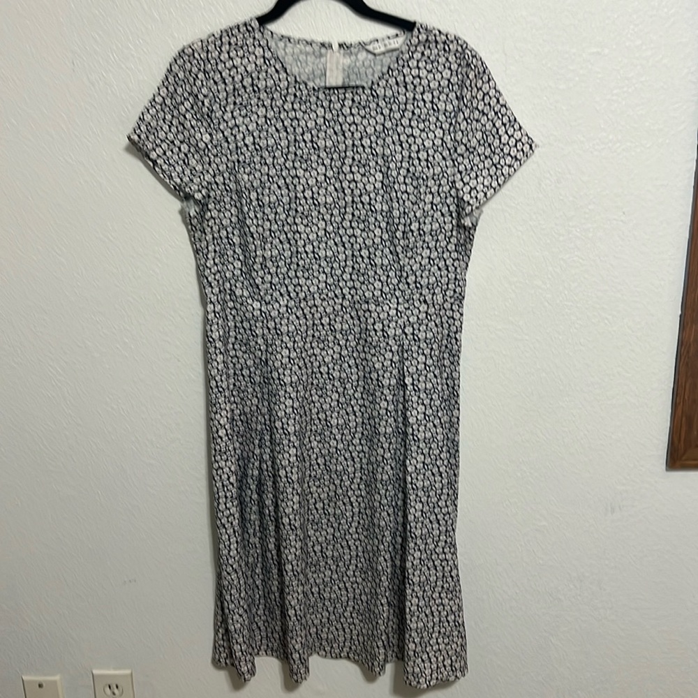 Light weight floral dress. Roomy through hips, front and back darts, unlined.